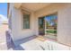 Covered patio with sliding glass door and outdoor rug at 38672 N Establo Dr, San Tan Valley, AZ 85140