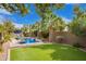 Well maintained yard with artificial turf, desert landscaping, and a pool at 3881 E Birchwood Pl, Chandler, AZ 85249