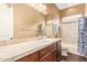 Bathroom featuring a wide countertop, integrated sink, and a shower-tub combination at 3881 E Birchwood Pl, Chandler, AZ 85249