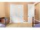 Bedroom featuring closet with sliding doors, neutral color scheme, and carpeted flooring at 3881 E Birchwood Pl, Chandler, AZ 85249