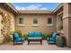 Private courtyard with brick pavers, comfortable seating area and string lights above at 3881 E Birchwood Pl, Chandler, AZ 85249