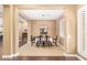 Formal dining room with carpet, plantation shutters and an elegant chandelier at 3881 E Birchwood Pl, Chandler, AZ 85249