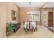 Elegant dining room with traditional furniture, light fixtures, and an ornate buffet table at 3881 E Birchwood Pl, Chandler, AZ 85249