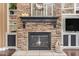 Close up of stone fireplace with a black mantle at 3881 E Birchwood Pl, Chandler, AZ 85249