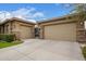 Detached garages on a large driveway with stone pillars that provide privacy at 3881 E Birchwood Pl, Chandler, AZ 85249