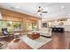 Living room with wood floors features large windows and an open layout at 3881 E Birchwood Pl, Chandler, AZ 85249