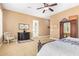 Bright main bedroom featuring a seating area, neutral carpeting, and access to the exterior at 3881 E Birchwood Pl, Chandler, AZ 85249