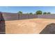 Blank canvas backyard with block wall fencing for privacy at 3906 N 103Rd Ave, Avondale, AZ 85392