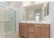 Bathroom featuring a double sink vanity and glass enclosed shower at 3906 N 103Rd Ave, Avondale, AZ 85392