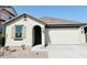 Charming one-story home showcasing a clean two-car garage, well-kept lawn, and inviting entrance at 3906 N 103Rd Ave, Avondale, AZ 85392