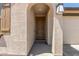 Close up of front door and covered entryway on a sunny day at 3906 N 103Rd Ave, Avondale, AZ 85392