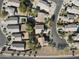 Overhead view of a neighborhood with green landscaping, tiled roofs, and a tranquil atmosphere at 39242 N Luke Cir, San Tan Valley, AZ 85140