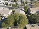 Aerial view of a residential area featuring well-kept homes with tiled roofs and mature landscaping at 39242 N Luke Cir, San Tan Valley, AZ 85140