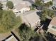 Aerial shot of a house showcasing the backyard and mature trees in a peaceful neighborhood at 39242 N Luke Cir, San Tan Valley, AZ 85140