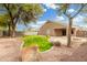 Expansive backyard with low-maintenance desert landscaping, and covered patio at 39242 N Luke Cir, San Tan Valley, AZ 85140