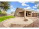 Landscaped backyard featuring a covered patio and low maintenance landscaping at 39242 N Luke Cir, San Tan Valley, AZ 85140