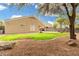 Low-maintenance backyard with desert landscaping and a covered patio at 39242 N Luke Cir, San Tan Valley, AZ 85140