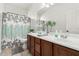 Bathroom with double sink vanity, tile flooring, and stylish mirror at 39242 N Luke Cir, San Tan Valley, AZ 85140