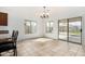 Open dining area with tile flooring and access to the backyard through sliding glass doors at 39242 N Luke Cir, San Tan Valley, AZ 85140