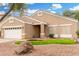 Attractive one-story home showcasing low-maintenance landscaping and a two-car attached garage at 39242 N Luke Cir, San Tan Valley, AZ 85140