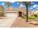 Charming single-story home featuring a well-maintained front yard and neutral color palette at 39242 N Luke Cir, San Tan Valley, AZ 85140