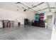 Spacious garage with ample storage, epoxy floor, and good lighting at 39242 N Luke Cir, San Tan Valley, AZ 85140