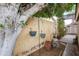 Cozy backyard with hanging planters and statue, enhancing the outdoor space with charm at 3938 E Gable Ave, Mesa, AZ 85206