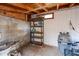 Unfinished basement with storage shelves, providing ample space for organization and utilities at 3938 E Gable Ave, Mesa, AZ 85206