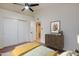 Bedroom featuring a ceiling fan, closet and a dresser at 3938 E Gable Ave, Mesa, AZ 85206