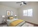 Cozy bedroom with vaulted ceiling, plush carpet, and bright natural light from window at 3938 E Gable Ave, Mesa, AZ 85206