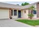 Charming single-story home featuring a lush lawn and mature landscaping at 3938 E Gable Ave, Mesa, AZ 85206