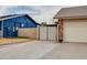 A well-maintained driveway featuring lush lawn, mature landscaping, and a gate at 3938 E Gable Ave, Mesa, AZ 85206