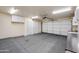 Open garage featuring white cabinets and multiple storage closets at 3938 E Gable Ave, Mesa, AZ 85206