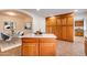 Open-concept kitchen featuring a functional island, ample cabinets, and a seamless flow into the dining area at 3938 E Gable Ave, Mesa, AZ 85206