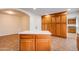 Kitchen island with storage and prep space, complemented by abundant wood cabinets for all your storage needs at 3938 E Gable Ave, Mesa, AZ 85206