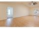 Spacious living room with tile floors, vaulted ceiling, ceiling fan, and seamless access to an adjacent bedroom at 3938 E Gable Ave, Mesa, AZ 85206