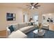 Bright living room featuring neutral paint, tile floors, modern furniture, and vaulted ceiling at 3938 E Gable Ave, Mesa, AZ 85206