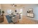 Bright living room featuring neutral paint, tile floors, modern furniture, and vaulted ceiling at 3938 E Gable Ave, Mesa, AZ 85206