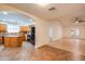 Spacious living room showcasing tile flooring, neutral walls, an arched entry to the kitchen, and airy ambiance at 3938 E Gable Ave, Mesa, AZ 85206