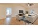 Comfortable living room with tile floors, vaulted ceiling, ceiling fan, and seamless access to an adjacent bedroom at 3938 E Gable Ave, Mesa, AZ 85206