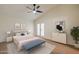 Relaxing main bedroom features a ceiling fan, decor and outside access through elegant French doors at 3938 E Gable Ave, Mesa, AZ 85206