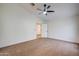 Bright main bedroom with carpet, ceiling fan, walk-in closet, ensuite bathroom and an adjacent bedroom at 3938 E Gable Ave, Mesa, AZ 85206