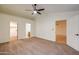 Tastefully staged main bedroom boasts ceiling fan, carpet flooring, ensuite bathroom and walk-in closet at 3938 E Gable Ave, Mesa, AZ 85206