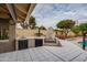 Covered outdoor patio featuring a built-in BBQ and cooking area at 3938 E Gable Ave, Mesa, AZ 85206