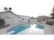 Home exterior featuring a backyard pool, covered patio, and lush landscaping at 3938 E Gable Ave, Mesa, AZ 85206