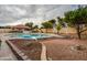 Backyard featuring a spacious in-ground pool, covered patio, and well-kept garden at 3938 E Gable Ave, Mesa, AZ 85206