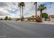 Charming single-story home featuring a lush lawn, mature landscaping, and a two-car garage at 3938 E Gable Ave, Mesa, AZ 85206