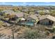 Aerial view of backyard featuring a sparkling pool and desert landscaping with mountain views at 40504 N Territory Trl, Anthem, AZ 85086