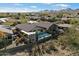 Aerial view of the backyard showcasing pool, patio, and landscaping with mountain backdrop at 40504 N Territory Trl, Anthem, AZ 85086