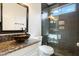 Bathroom featuring modern sink, shower with glass door, and neutral walls at 40504 N Territory Trl, Anthem, AZ 85086